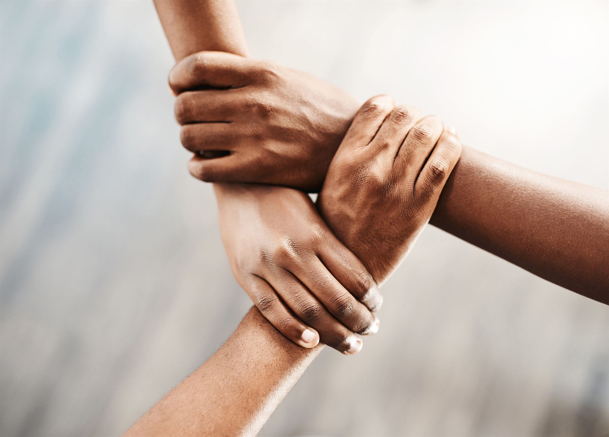 Hands joined symbolizing teamwork